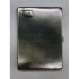 A Silver cigarette case with initials JB, indistinct hallmark.