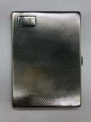 A Silver cigarette case with initials JB, indistinct hallmark.
