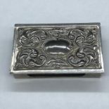 A White metal match box holder