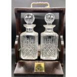 A cased set of decanters