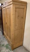 A two door pine wardrobe with two drawers under AF (no fittings) H204cm W141cm D65cm