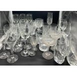 A mixed selection of glassware including champagne coupes and wine glasses