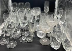 A mixed selection of glassware including champagne coupes and wine glasses