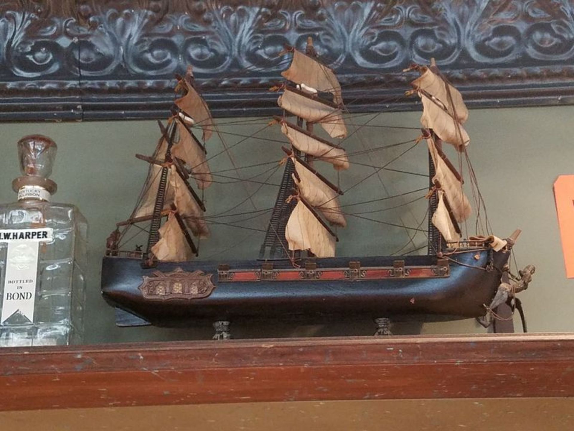 Lot - Model Ship, L.W. Harper Bottle, Assorted Bottles, Etc., with Shelf (Wall-Mounted)