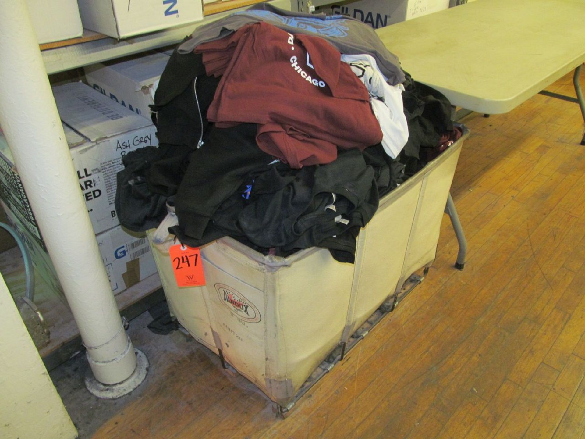 Lot - Mis-Printed T-Shirt Inventory, with Laundry Bin