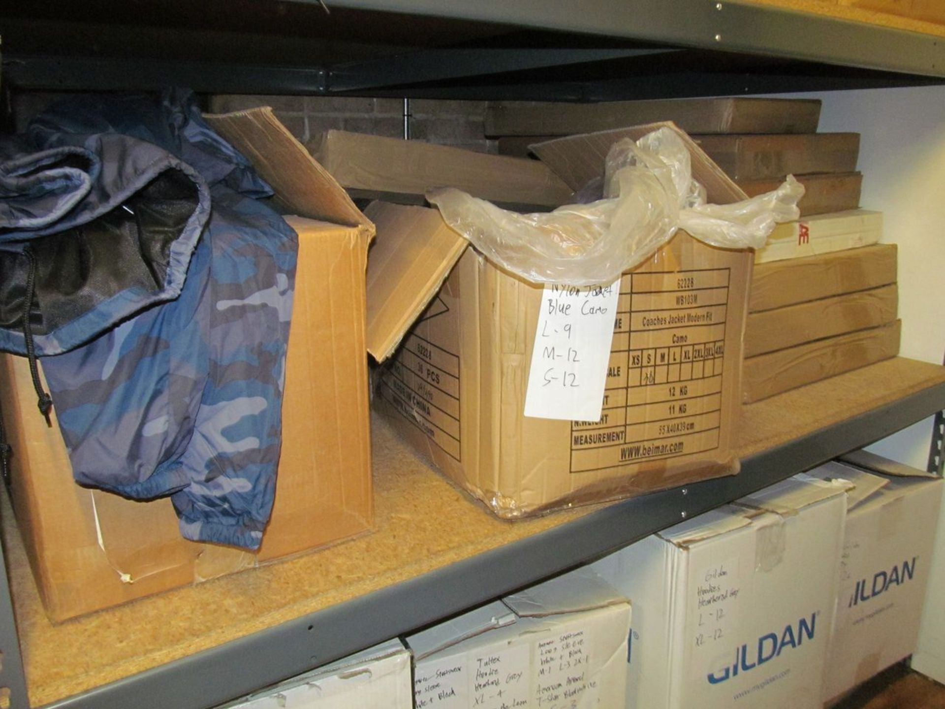 Lot - Contents of Shelf, to Include: (4) Boxes Un-Printed Nylon Jackets (Camo, Blue Camo, Black), ( - Image 2 of 3
