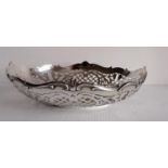 An early 20th century silver oval pierced basket with wavy rim, scallop decoration, French 800