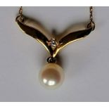 A Mikimoto 18ct yellow gold pearl and diamond pendant necklace with conforming chain, both stamped