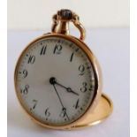 An Edwardian 18k gold-cased (and dust cover) ladies fob watch with Arabic numerals, enamel dial