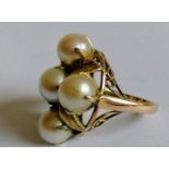 A mid-century pearl and gold dress ring with leaf decoration, size K, stamped 14k, 8.8g