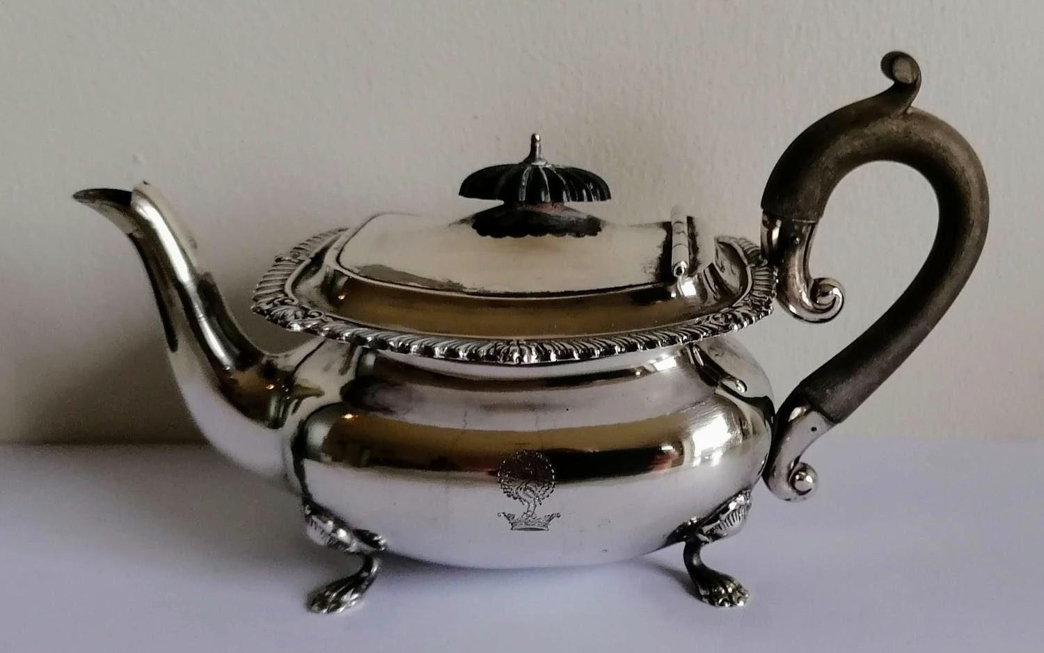 A late Victorian silver bachelor teapot with gadrooned rim, wood knop and handle, on four shell - Image 2 of 2