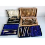 A George V cased silver manicure set by Daniel Manufacturing Company, 1924; another by W I