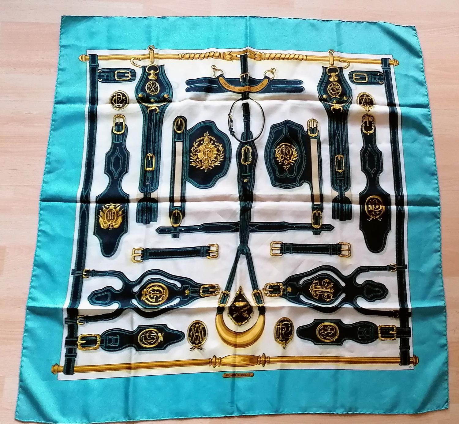 A Hermès 'Harnais Des Presidents' silk scarf, designed by Françoise Heron on a turquoise border,