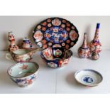 An assortment of 19th century Imari vases, bowls and plate, etc, chip to oval plate