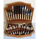 An oak-cased canteen of silver plated cutlery with ivory handles by James Deakin & Sons,