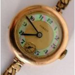 A mid-20th century Corect ladies wristwatch in a 14K yellow gold case, in working order,