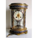 A late 19th century oval French gilt champleve mantel clock by Japy Freres, with key