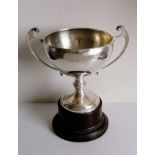 An Art Deco silver two-handled trophy cup on a bakelite base, Birmingham, 1934, maker's mark rubbed,