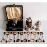 An Edwardian set of twelve silver coffee bean spoon by William Suckling Ltd., Birmingham, 1906; a