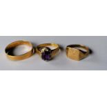A yellow gold wedding band, 2.5g; a gem-set ring, 4.8g, both 18ct, and a 9ct yellow gold signet