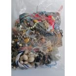 An assortment of mixed costume jewellery, etc