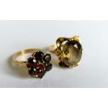 Two gem-set dress rings on 9ct yellow gold claw settings, sizes R, hallmarked, 10.5g (2)