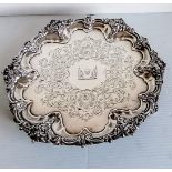 A Victorian silver slaver with applied rococo decoration to rim, etching to centre, crested, on