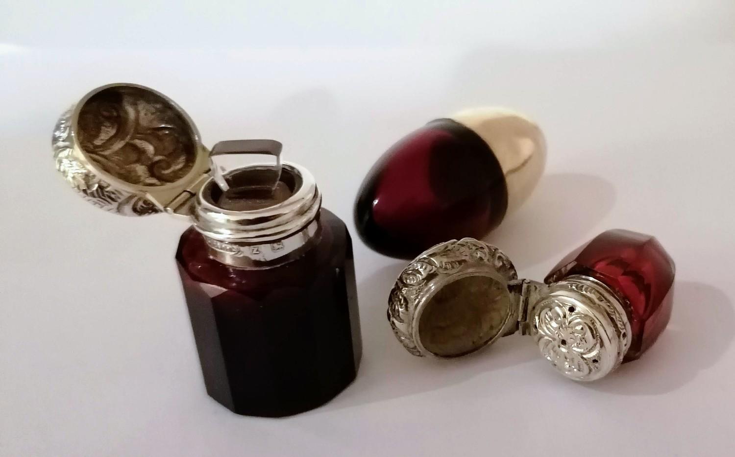 A Victorian silver-topped ruby glass scent bottle with embossed flip-top cap, original stopper by - Image 2 of 2