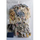 An assortment of mixed costume jewellery, etc