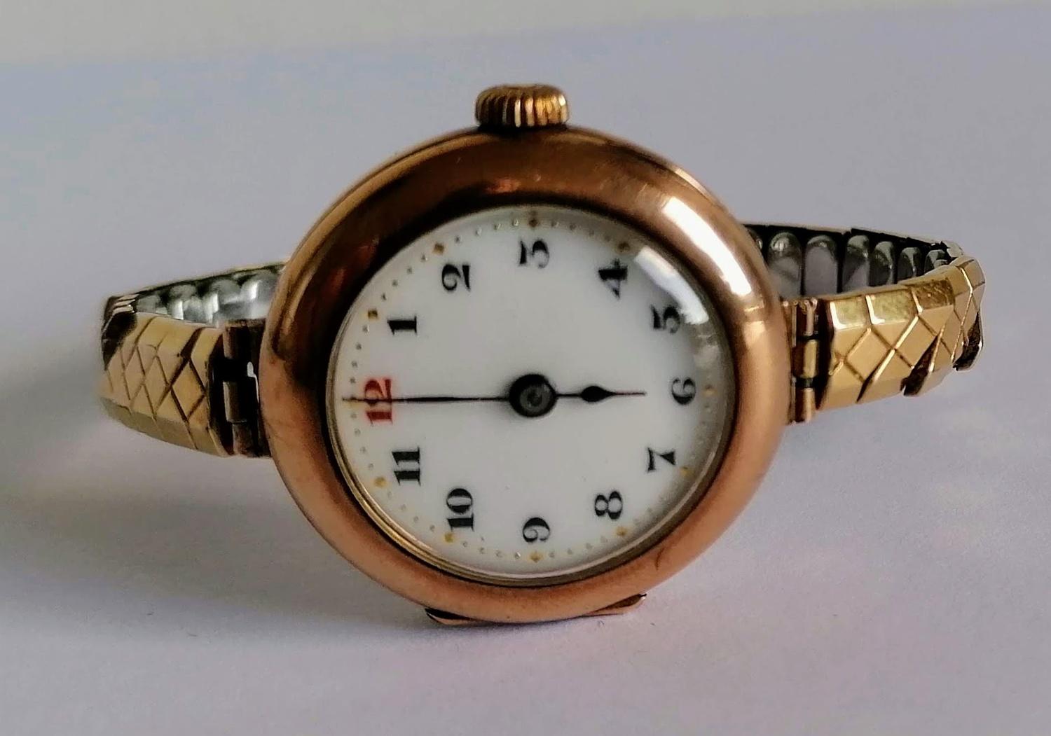 A WW1 ladies gold-cased Rolex manual wristwatch with Arabic numerals, enamel dial 25mm, hallmarked