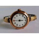 A WW1 ladies gold-cased Rolex manual wristwatch with Arabic numerals, enamel dial 25mm, hallmarked