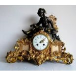 A 19th century French gilt and bronzed figural mantel clock with Arabic numerals and painted
