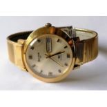 A Bulova 23 jewel day/date automatic wristwatch with baton markers, sweeping seconds hand in a