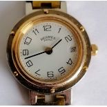 Hermes Clipper quartz watch in gold plate and stainless steel, date aperture, Arabic numerals,