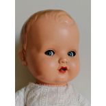 An Averill 'Bonnie Babe' celluloid head baby doll with moulded painted hair, cloth body and limbs,