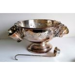 A silver plated punch bowl with lion mask handles, six goblets and a ladle, 20 x 32 cm diameter