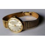 A mid-century ladies Omega manual watch with baton markers, 9ct gold case and mesh strap (kink to