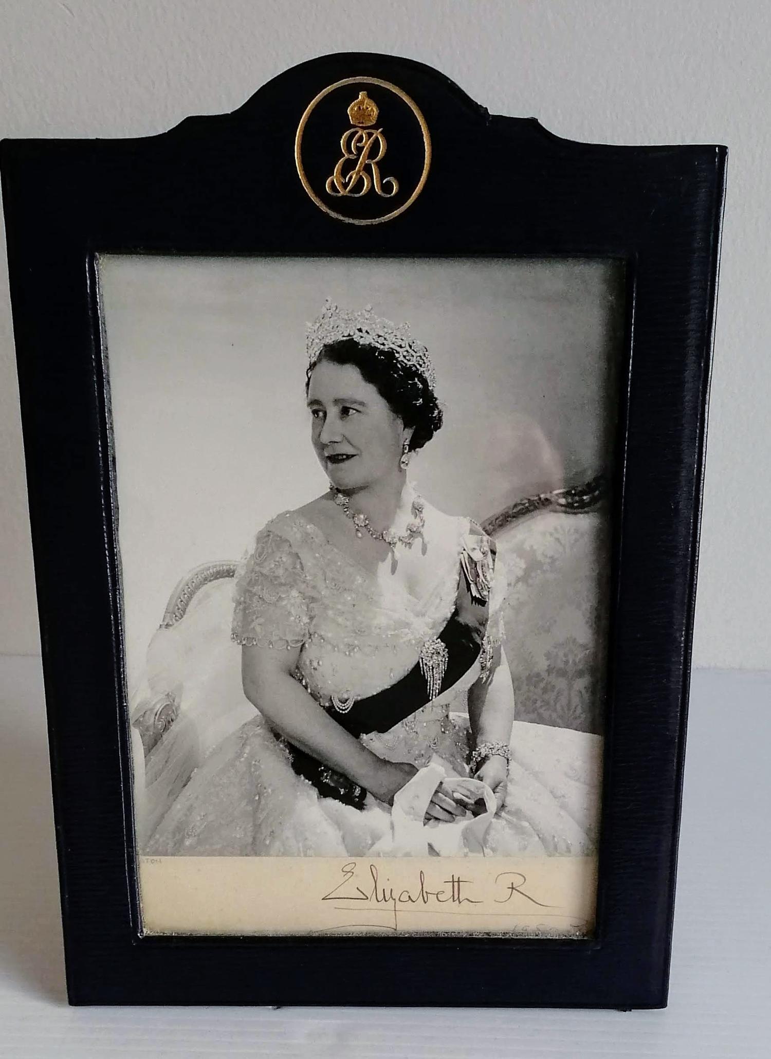 A silvered mounted photograph of the Queen Mother by Cecil Beaton, signed 'Beaton' in pencil and '