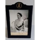 A silvered mounted photograph of the Queen Mother by Cecil Beaton, signed 'Beaton' in pencil and '