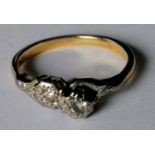 A gold and platinum diamond crossover ring, marks rubbed, size I, 2.19g