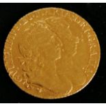 A William and Mary one guinea gold coin 1694, conjoined busts right, 8.4g