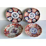 A pair of 19th century Japanese Imari medallion plates and two others with blue and ochre floral