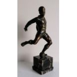After Ferdinando de Luca (Italian XX) a bronze figure of a footballer on a marble base, signed, 34.5