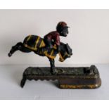 A late Victorian cast metal comical jockey money box, possible maker of J E Stevens, embossed