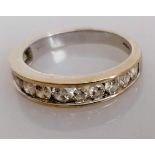 An 18ct white gold half-hoop diamond eternity ring with twelve graduated stones ranging from 0.05 to