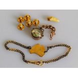 An assortment of 9ct gold items to include compass, map of Australia, hallmarked and five dress