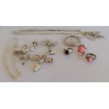 An assortment of silver jewellery to include a charm bracelet, a mounted 1913 drei mark coin with