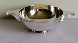 A George V silver quaich on a spreading foot by Henry Williamson Ltd, Birmingham, 1919, 5.5 x 20 cm,