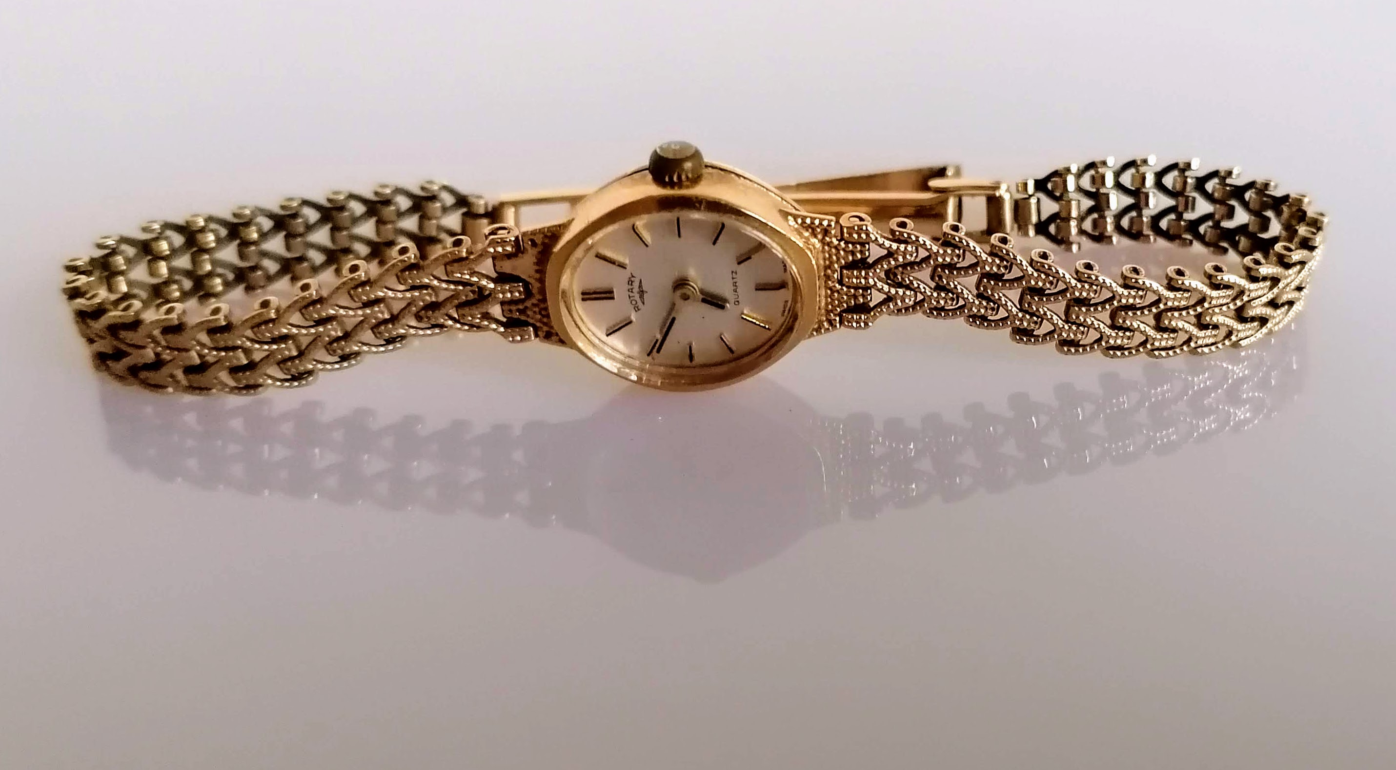 A gold mid-century ladies Rotary dress watch with mesh bracelet, hallmarked 9ct, 10.83g