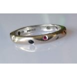 A Jeremy Hoyle carved 18ct carat white gold eternity ring with multi-coloured diamonds, size K 1/